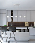 5 Light LED Pendant Chandelier for Kitchen Island, Dimmable Modern Fixture in Brushed Nickel highlighting a sleek kitchen