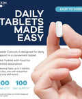 Calcium 600 Mg Supplement For Strong Bones Joints And Teeth Supports Healthy Muscle And Nerve Function Easy To Swallow Coated Tablets Gluten Free 100 Count shown with hand holding pill