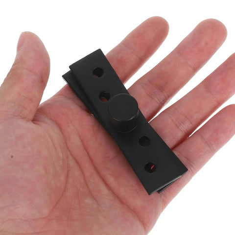 Hand holding Beefy Heavy Duty Stainless Steel Concealed Pivot Door Hinge with black center shaft, 360 degree rotation hardware