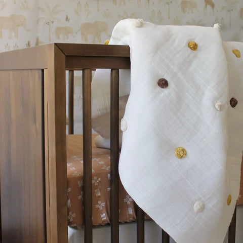 Traditional Paste The Wall Safari Nursery Wallpaper With Watercolor Lions Elephants And Giraffes Print In Neutral Jungle Tones For Baby Rooms Cozy Neutral Decor 20.87 Inch By 270 Inch Roll behind crib with polka dot blanket