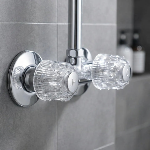 Close-up of two pack crystal clear acrylic shower knob replacement kit with hot and cold buttons installed on faucet