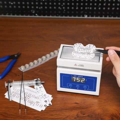 Person using Pro Grade Compact LED Soldering Hot Plate For SMD Rework And BGA Chips 100x50mm 210W Preheater Station