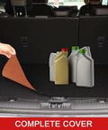 Oil Spill Mat For Garage Floor Absorbs Oil And Liquids With Waterproof Backing Keeps In Place Reusable Washable Heavy Duty 29 By 36 Inches Black And Orange To Protect Concrete From Stains in a car trunk with bottles on top