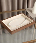 Slick Walnut Wood Jewelry Display Tray With Dope 24 Compartments For Rings Earrings Necklaces showcasing a pearl necklace.