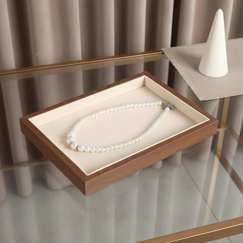 Slick Walnut Wood Jewelry Display Tray With Dope 24 Compartments For Rings Earrings Necklaces showcasing a pearl necklace.