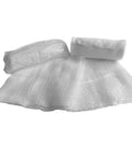 First aid training kit components: white gauze roll and folded gauze sheet