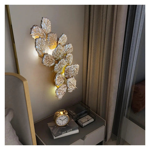 Top Shelf Modern Wall Sconce With Chill Ambient Glow For Living Room And Bedroom Background Decoration Built Like A Tank Perfect For TVs And Snug Spaces, leaf design, mounted near bedside.
