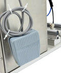 Hella Compatible 110V Semi Automatic Vacuum Capping Machine foot pedal control with coiled gray cable for easy operation.