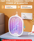 Electric Fly Swatter Zapper Racket 4000V with 1800mAh rechargeable battery charging via USB on a table.