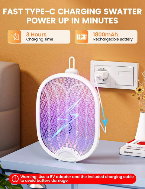 Electric Fly Swatter Zapper Racket 4000V with 1800mAh rechargeable battery charging via USB on a table.