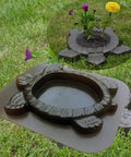Turtle Stepping Stone Mold for Concrete Pathways 17.3 by 15 by 1.6 Inch Cement Mold shown with plant in center on lawn.