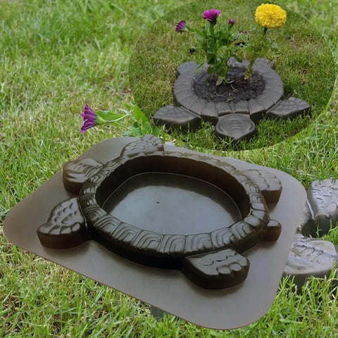Turtle Stepping Stone Mold for Concrete Pathways 17.3 by 15 by 1.6 Inch Cement Mold shown with plant in center on lawn.
