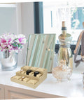 Top Linen Watch Tray With 9 Grids For Jewelry And Watch Storage on a desk, featuring watches in each grid and decorative items.