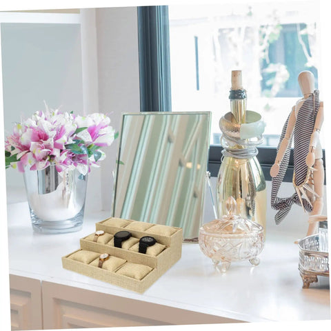 Top Linen Watch Tray With 9 Grids For Jewelry And Watch Storage on a desk, featuring watches in each grid and decorative items.