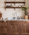 Premium Antique Brass Cabinet Knobs Paired With Elegant Oval Backplates 6 Pack on walnut kitchen cabinetry.