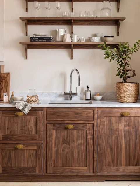 Premium Antique Brass Cabinet Knobs Paired With Elegant Oval Backplates 6 Pack on walnut kitchen cabinetry.