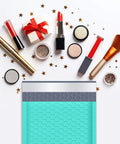 Teal Bubble Mailers 6x10 Inch Inner 6x9 Inch 25 Pack Padded Envelopes with makeup items and stars around them