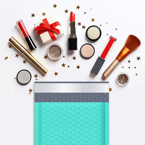 Teal Bubble Mailers 6x10 Inch Inner 6x9 Inch 25 Pack Padded Envelopes with makeup items and stars around them