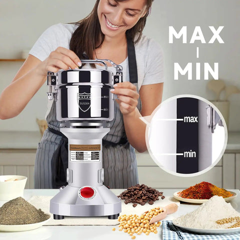 Woman using Beast 2000W Grain Grinder Mill With 550g Capacity Stainless Steel High Speed Pulverizer in home kitchen