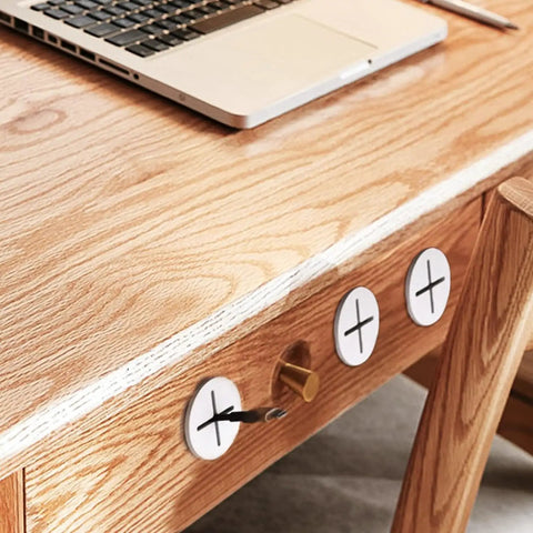 Three Twelve Pack One Inch White Silicone Cable Grommets For Home Office Desk covering wire holes in wooden desk.