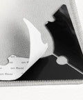 Non Slip Rug Corner Grippers Pack Of 8 with dual sided adhesive shown under rug corner on laminate floor