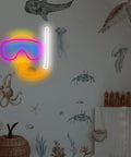 Neon Sign Diver Mask Style Scuba Diving LED Neon Light For Wall Decor And Beach House Dope Vibe Perfect For Dive Shops Ocean Theme Rooms Bathroom Game Room And Underwater Spaces glowing on wall with ocean mural