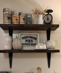 Kitchen shelf setup with coffee and tea decor supported by Beefed Up Heavy Duty Black Metal Floating Shelf Brackets Set 4x3 Inch L Brackets.