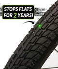 Close-up of a bike tire highlighting the extra strong self sealing bicycle tube, 26 inch, preventing flats with slime sealant.