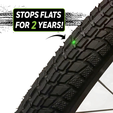 Close-up of a bike tire highlighting the extra strong self sealing bicycle tube, 26 inch, preventing flats with slime sealant.