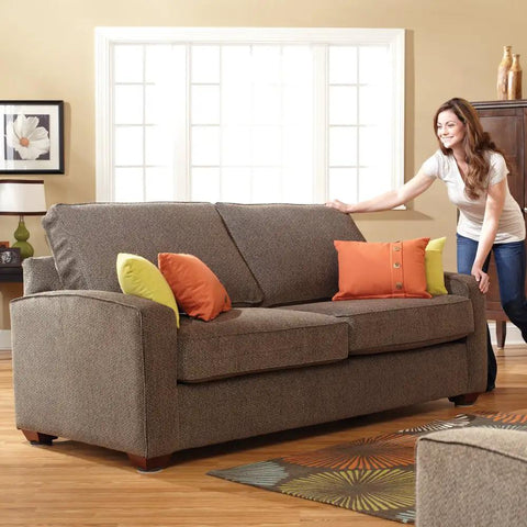 Person using 20 Piece Assorted Felt Furniture Sliders Set For Hard Surfaces to move a sofa on hardwood floor
