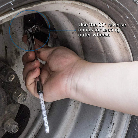 Side view of a silver CZC Auto pencil tire pressure gauge with stainless steel stem testing a car tire valve on a wheel