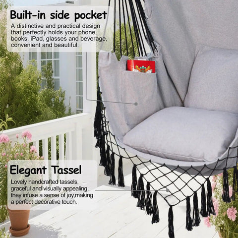 Close-up of hammock chair hanging rope swing chair for indoor outdoor use built for chill comfort up to 450 lbs large with pocket and two cushions removable steel bar hardware kit included light grey showing side pocket and elegant tassel detail on patio.