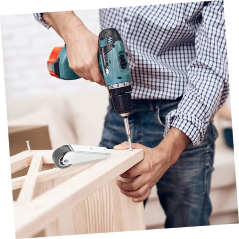 Man using a power drill to install Heavy Duty 2 Piece Barn Door Rollers With Galvanized Nylon Sliding Track Wheels And Bottom Guide Pulley.