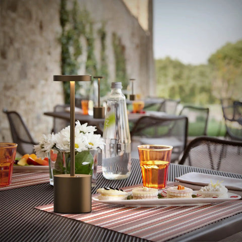 Cordless Rechargeable Table Lamp With 5000mAh Battery on outdoor dining setup with food and drinks, USB Powered Desk Light in Metal Aluminum Housing.