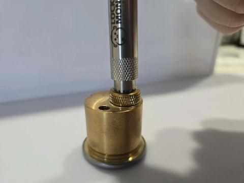 Hollow Stainless Steel Lock Cylinder Cap Removal Tool with grippy texture shown in use on a lock cylinder for rekeying