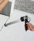 Top Tier Metal Caulk Gun With Thick Half Round Rod For Windows Doors And Bathroom Sealant Worry Free Application Adhesive Applicator in use