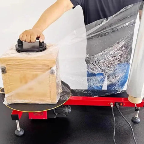 Electric Stretch Film Wrapping Machine Wrap Around Film Balers 15 7 Inch Turntable 30 Rpm High Speed Motor sealing a wooden box.