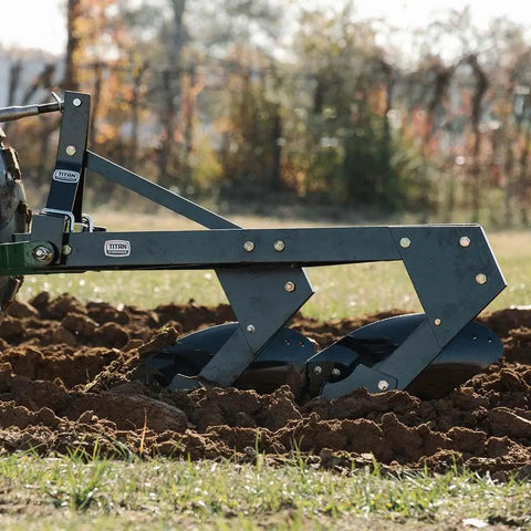 Three Point 21 Inch Double Moldboard Turn Plow for Category 1 Tractors tilling soil in a field