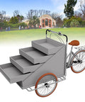 Slick Large Reverse Tricycle Vending Cart With Smooth Pedal Assist Front Loading Frame Four Tier Rollout Rack Sweet Mobile Food Beverage Hustle Rig For Flea Market Gray side view showing four rolling tiers and brown seat.
