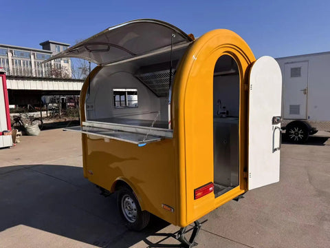 Road Ready Mobile Food Truck Trailer With Dope Commercial Kitchen Setup, yellow exterior, open door showcasing workspace.