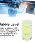 Small Spirit Level Square Bubble Level High Optical Transparency Material next to a 3D printer, demonstrating usage.