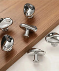 Antique Style Chrome Furniture Handles and Cabinet Knob Set for drawers and closet doors on wooden surface