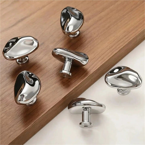 Antique Style Chrome Furniture Handles and Cabinet Knob Set for drawers and closet doors on wooden surface