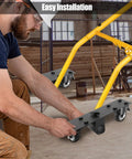Man installing Rolling Caster Kit For Miter Saw Stand DWX726 Heavy Duty Steel Wheels With Brake Lock in workshop