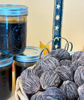 Black Walnut Wood Stain 1 Pint Water Based Non Toxic Low Odor Rich Dark Tone in jars with walnut shells in a basket.