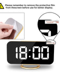 Peeling film from 7 Inch LED Mirror Display Alarm Clock With Dual USB Ports, Auto Dim And Night Mode, sleek gold finish