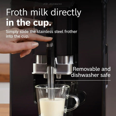 Frothing milk using fully automatic espresso machine with ceramic burr grinder for perfect bean to cup coffee.