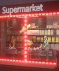 Storefront RGB LED Strip Lights With Bluetooth App Control And Remote, 120Ft Waterproof Sign Lighting Kit highlighting a supermarket display