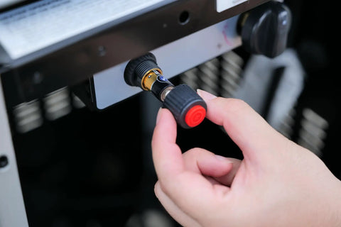 Hand adjusting control knob on Pyramid Patio Heater With 48000 BTU Output For Outdoor Comfort Propane Fueled Heat For Patios And Commercial Spaces Double Layer Stainless Steel Burners Triple Protection System Black