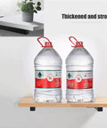 Hella Sturdy Black Industrial Floating Shelf Brackets Set Of Two Heavy Duty Wall Mount supports showcasing two 5L water bottles.